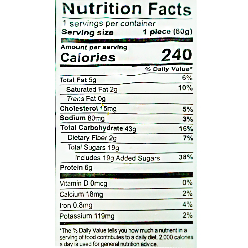 This 80g serving of baked wheat cake contains 240 calories, 5g of total fat, 2g of saturated fat, 15mg of cholesterol, 80mg of sodium, 43g of total carbohydrates, 2g of dietary fiber, 19g of total sugars including 19g of added sugars, and 6g of protein.