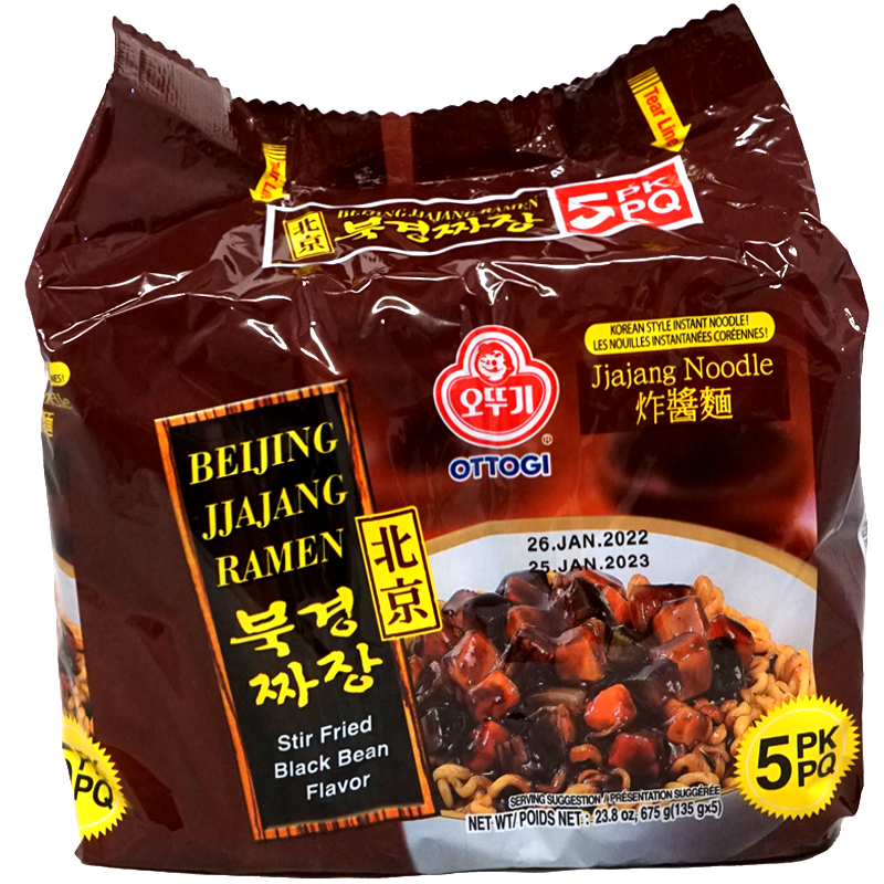 Front view of Ottogi Beijing Jjajang Ramen packaging, Stir Fried Black Bean Flavor. The package features a rich brown design with an image of noodles topped with a savory black bean sauce and vegetables. The text in both English and Chinese emphasizes the stir fried black bean flavor. The package contains five individual packs, each weighing 135g, with a total net weight of 675g.